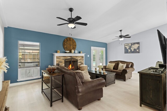 2113 Victoria Rd, Carrollton, TX 75007 - living area with lofted ceiling, a ceiling fan, light wood-type flooring, baseboards, and a brick fireplace