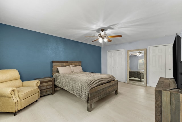 2113 Victoria Rd, Carrollton, TX 75007 - bedroom with light wood-type flooring, multiple closets, and ceiling fan
