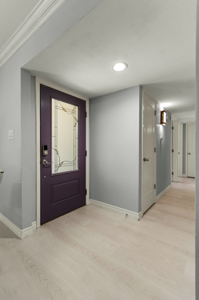 2113 Victoria Rd, Carrollton, TX 75007 - foyer entrance with recessed lighting, light wood-style flooring, a textured ceiling, and baseboards