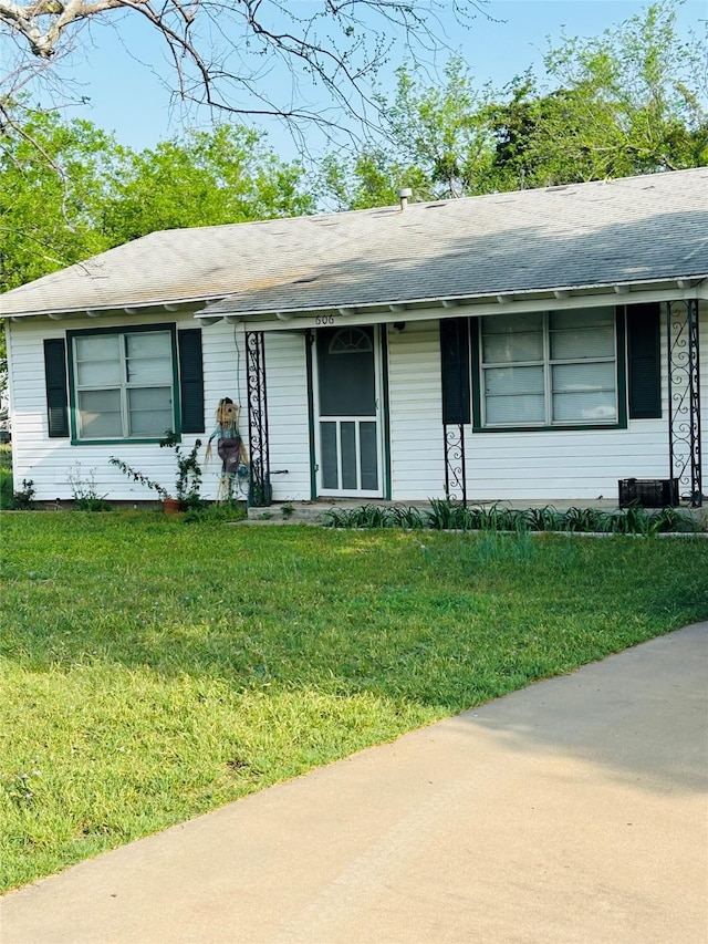 ranch-style home with a front lawn