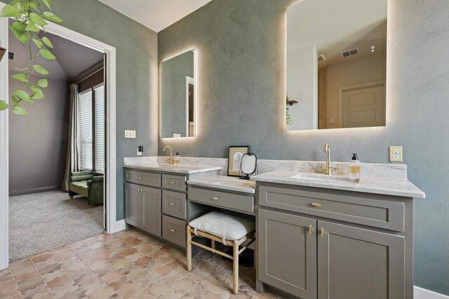 1304 S Pecan Pkwy, Northlake, TX 76247 - full bathroom featuring double vanity, stone finish flooring, visible vents, a sink, and baseboards