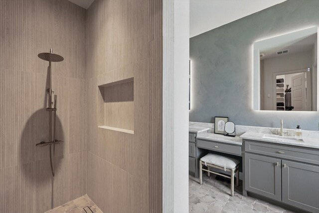 1304 S Pecan Pkwy, Northlake, TX 76247 - bathroom featuring vanity, a tile shower, and visible vents