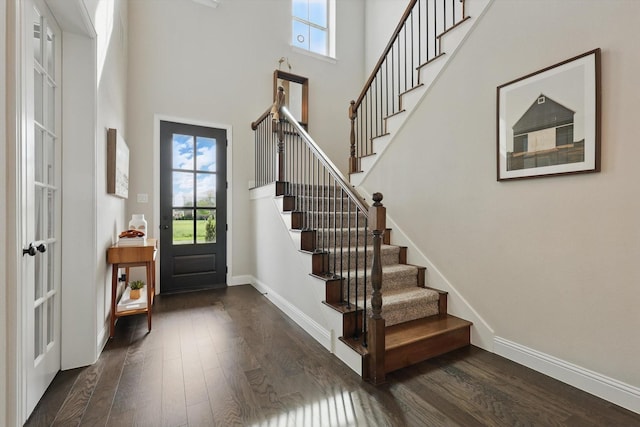 1304 S Pecan Pkwy, Northlake, TX 76247 - entryway featuring dark wood-style flooring, a towering ceiling, and stairway