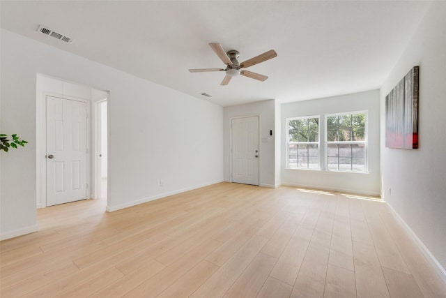 5816 Kilpatrick Ave, Fort Worth, TX 76107 - empty room with a ceiling fan, light wood-style flooring, and baseboards