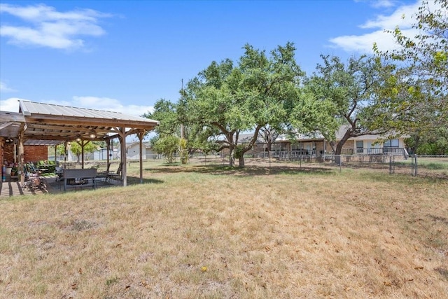 view of yard featuring a gazebo and fence