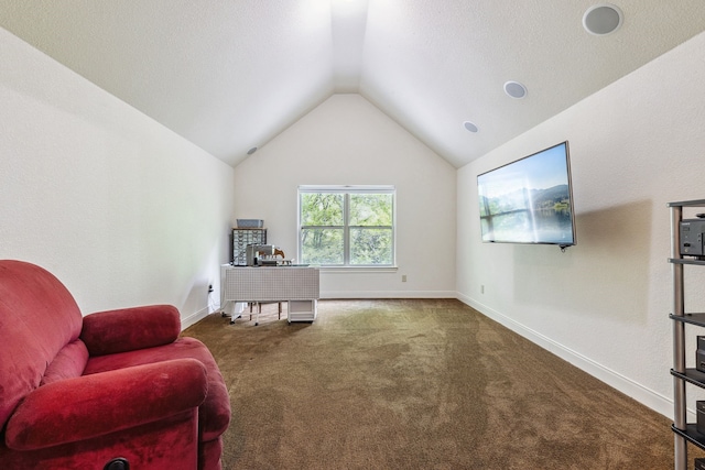 sitting room with lofted ceiling, baseboards, and carpet floors