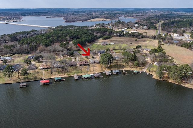 birds eye view of property featuring a water view
