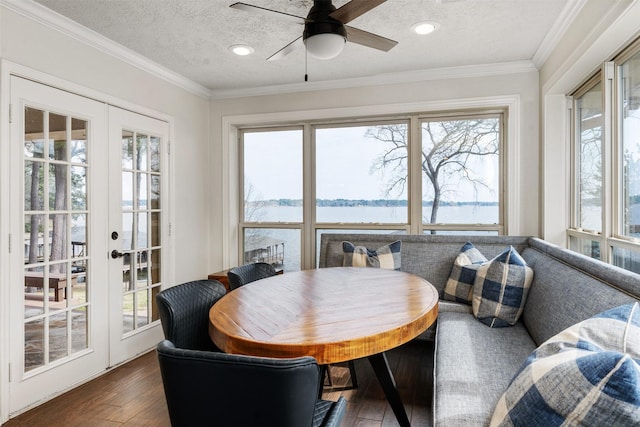 sunroom featuring french doors and a wealth of natural light