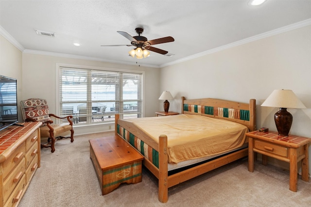 bedroom with ornamental molding, light carpet, recessed lighting, a ceiling fan, and visible vents
