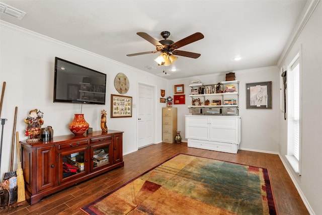 bedroom with visible vents, multiple windows, crown molding, and wood finished floors