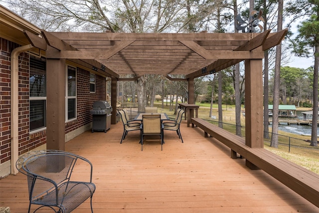 deck featuring a pergola, outdoor dining area, and grilling area