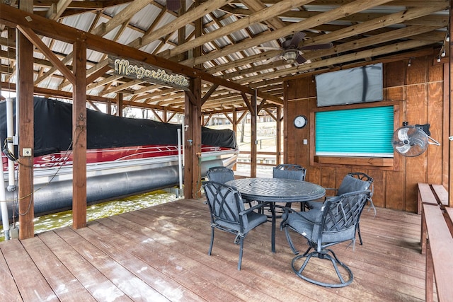 deck with a boat dock and boat lift
