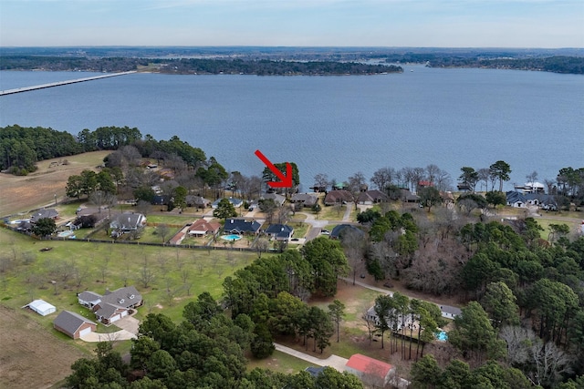 bird's eye view featuring a water view and a residential view