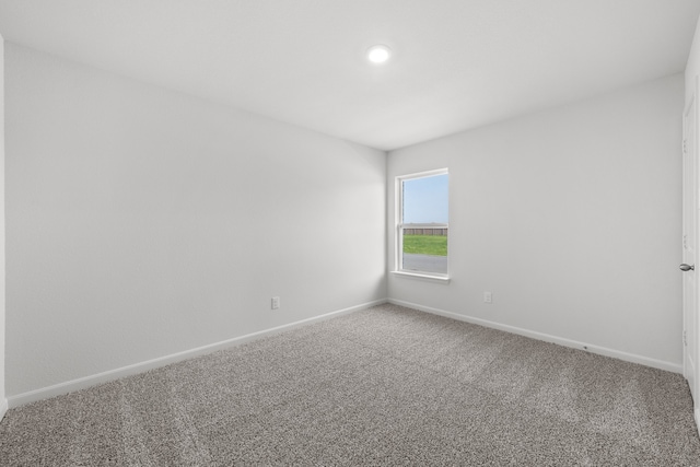 carpeted spare room with baseboards and recessed lighting