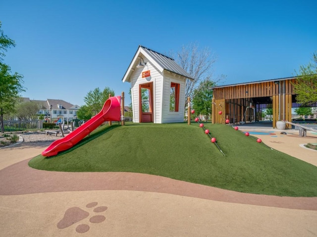 view of play area featuring an outdoor structure