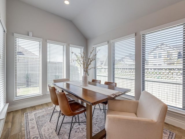 dining area featuring baseboards, recessed lighting, wood finished floors, and vaulted ceiling