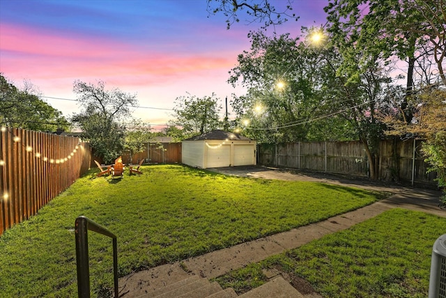 1622 Hollywood Ave, Dallas, TX 75208 - view of yard with a detached garage, a fenced backyard, and an outbuilding
