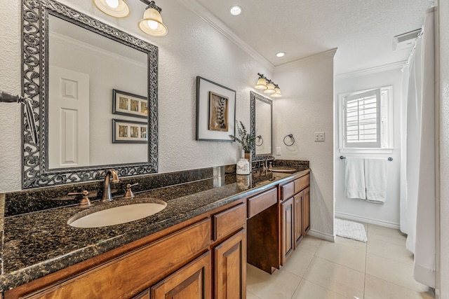 full bathroom with crown molding, double vanity, a sink, and tile patterned flooring
