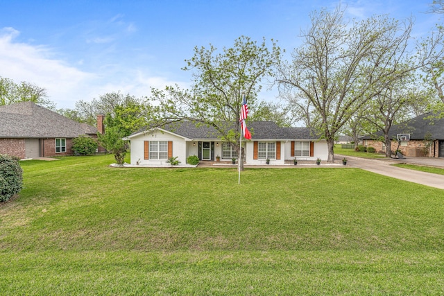 ranch-style home featuring a front yard and driveway