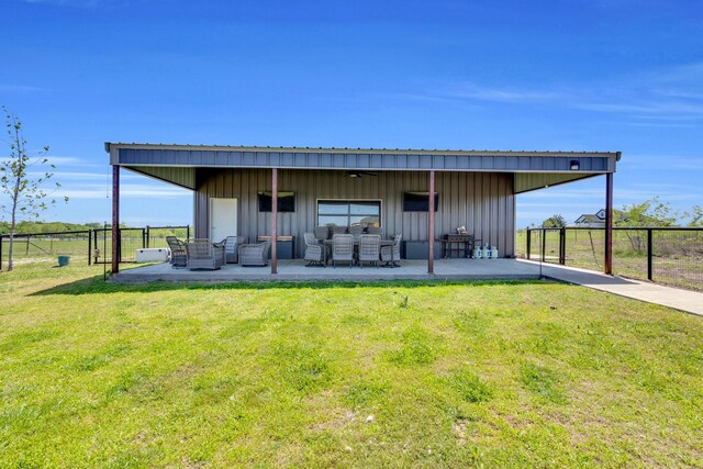 view of outbuilding featuring fence