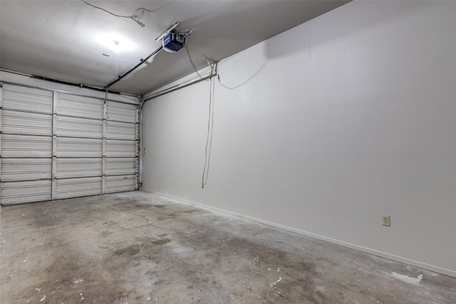 1303 N Church St, Mckinney, TX 75069 - garage with a garage door opener and baseboards