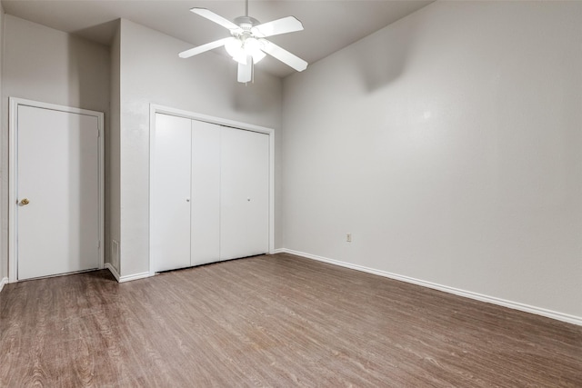 1303 N Church St, Mckinney, TX 75069 - unfurnished bedroom featuring a closet, baseboards, a ceiling fan, and wood finished floors