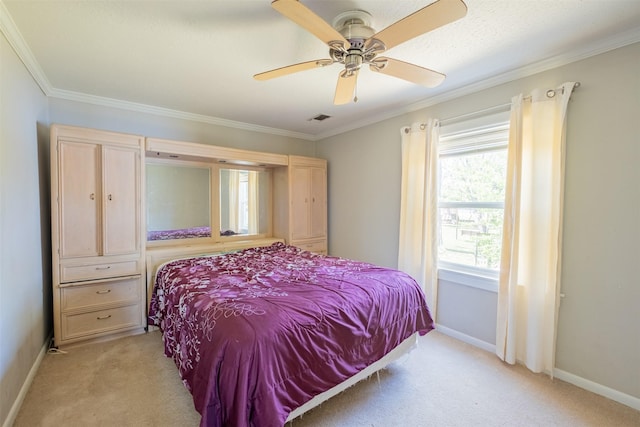 bedroom featuring crown molding, light colored carpet, a ceiling fan, visible vents, and baseboards