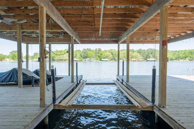 view of dock featuring a water view and boat lift