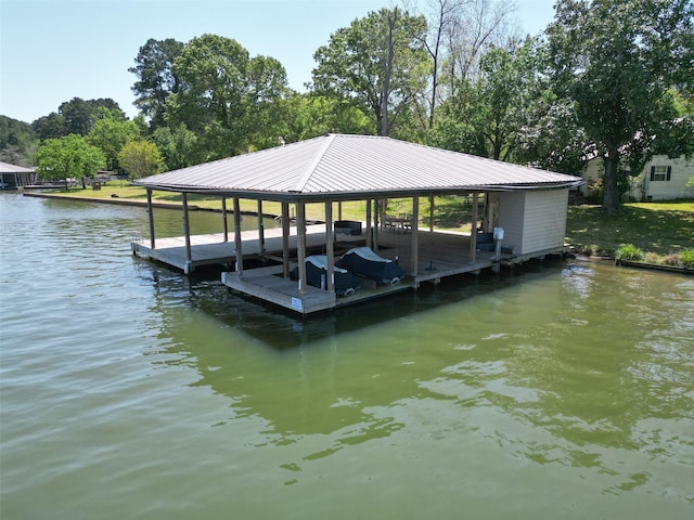 dock area featuring a water view and boat lift