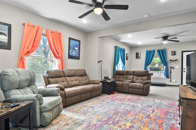 living area with recessed lighting, a ceiling fan, plenty of natural light, and carpet floors