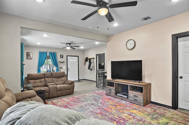 carpeted living area featuring visible vents, baseboards, a ceiling fan, and recessed lighting