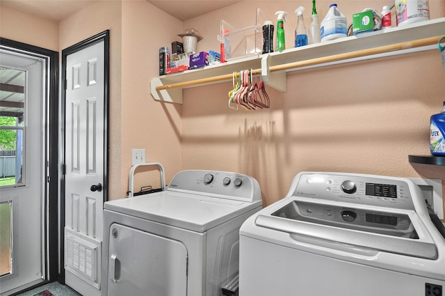laundry room with washer and clothes dryer and laundry area