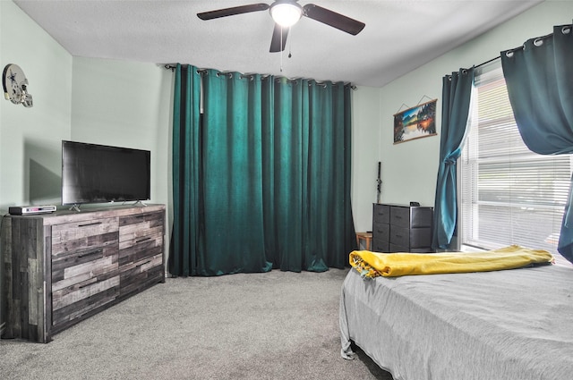 carpeted bedroom with a ceiling fan