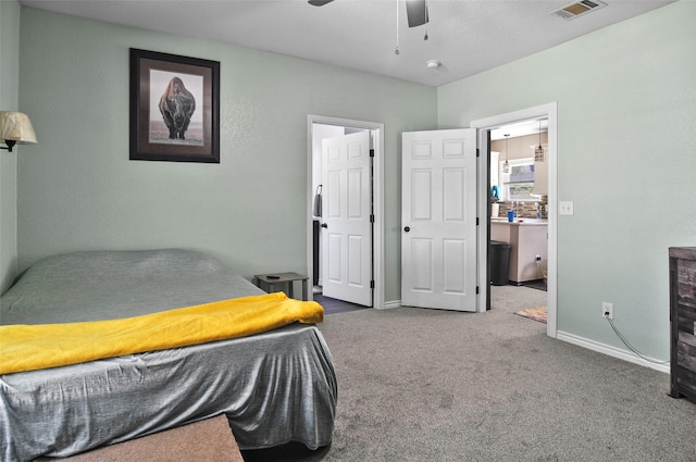 bedroom featuring visible vents, baseboards, ceiling fan, and carpet floors
