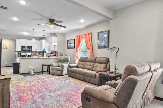 living room with baseboards, a ceiling fan, visible vents, and recessed lighting