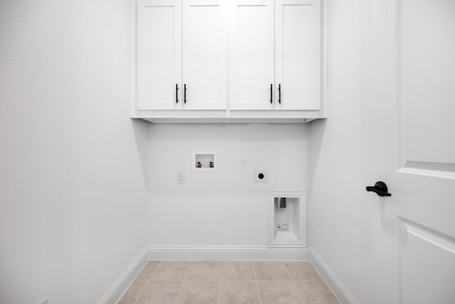 1525 Ginger Ln, Argyle, TX 76226 - washroom featuring electric dryer hookup, cabinet space, gas dryer hookup, and baseboards