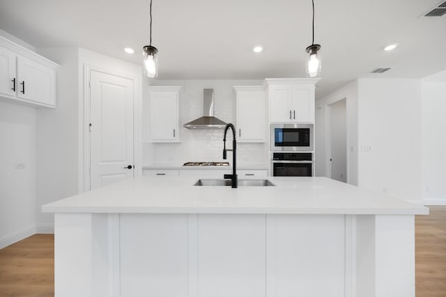 1525 Ginger Ln, Argyle, TX 76226 - kitchen with white cabinetry, appliances with stainless steel finishes, visible vents, baseboards, and wall chimney exhaust hood