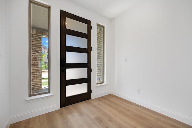 1525 Ginger Ln, Argyle, TX 76226 - entryway featuring light wood-style flooring and baseboards