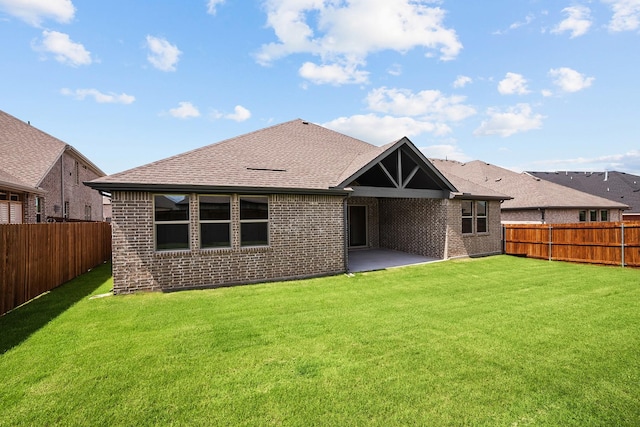 763 Emerald Hts, Lavon, TX 75166 - back of house with brick siding, a patio area, and a shingled roof