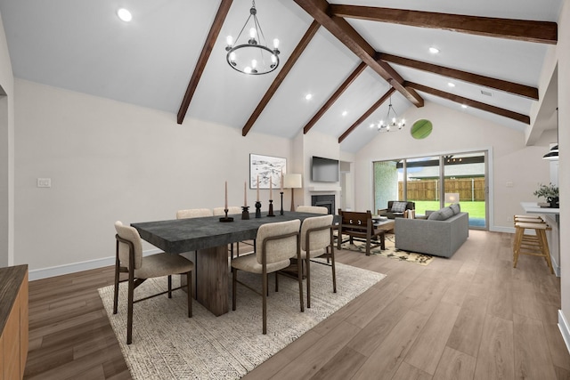 763 Emerald Hts, Lavon, TX 75166 - dining space featuring a chandelier, a fireplace, beamed ceiling, wood finished floors, and recessed lighting
