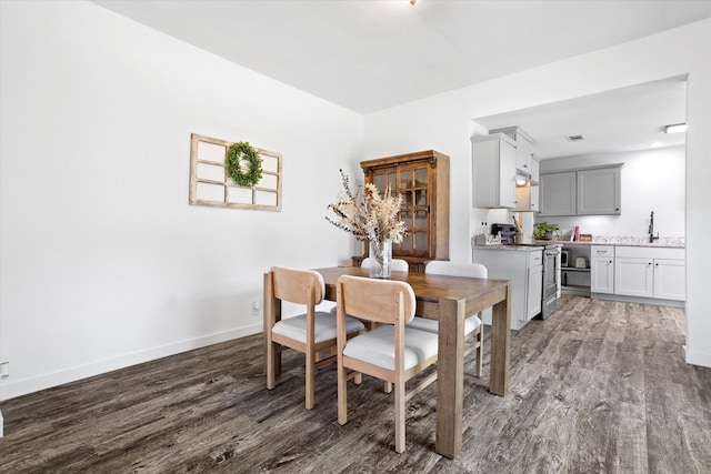 500 E Criner St, Grandview, TX 76050 - dining room with dark wood-style floors and baseboards