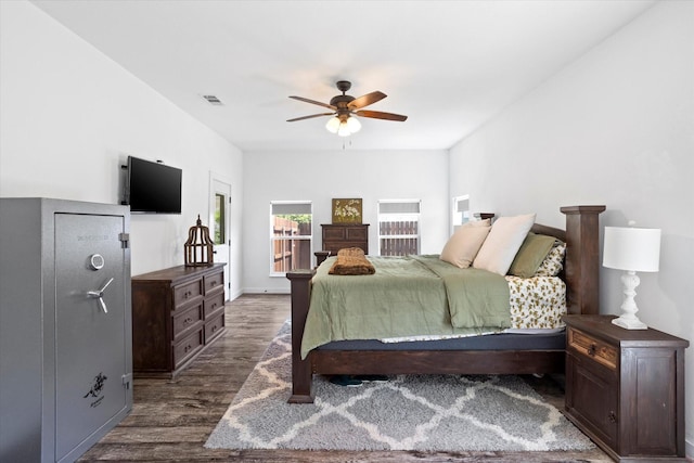 500 E Criner St, Grandview, TX 76050 - bedroom with visible vents, ceiling fan, and dark wood finished floors