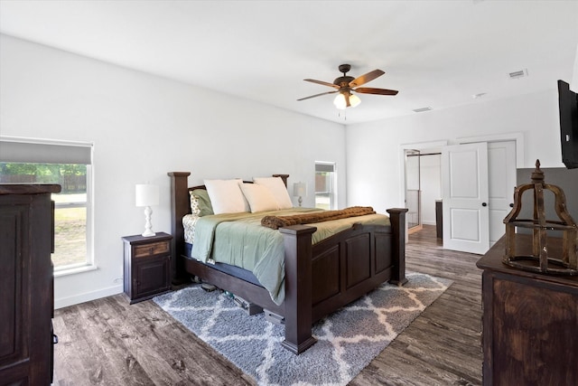 500 E Criner St, Grandview, TX 76050 - bedroom with wood finished floors, baseboards, and multiple windows
