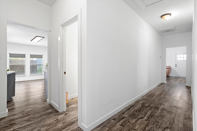 500 E Criner St, Grandview, TX 76050 - hallway with baseboards, visible vents, and dark wood-style flooring
