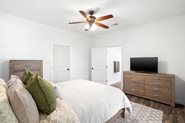 500 E Criner St, Grandview, TX 76050 - bedroom with dark wood finished floors, visible vents, ceiling fan, and baseboards