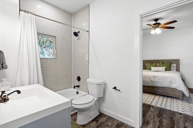 500 E Criner St, Grandview, TX 76050 - ensuite bathroom featuring a sink, toilet, a ceiling fan, baseboards, and wood finished floors