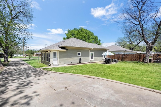 500 E Criner St, Grandview, TX 76050 - rear view of property with fence, a yard, and a patio area