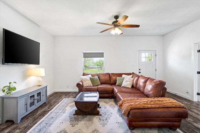 500 E Criner St, Grandview, TX 76050 - living room with baseboards, a ceiling fan, wood finished floors, and a wealth of natural light