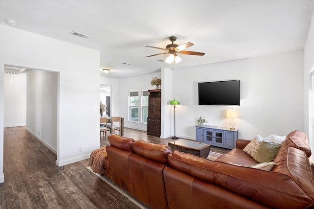 500 E Criner St, Grandview, TX 76050 - living area with baseboards, visible vents, wood finished floors, and ceiling fan