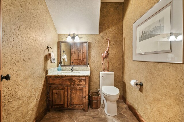 mudroom with baseboards and washer / dryer